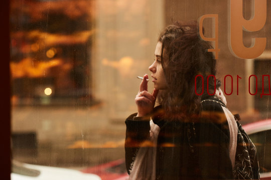 A girl smoking at a cafe of Saint Peterburg