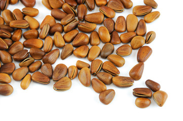 fresh pine nuts isolated on white background