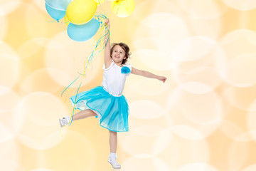 Little girl with multicolored balloons.