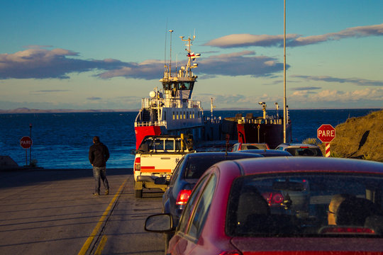 Row of cars waiting to cross the Strait of Magellan, Patagonia, Chile, South America.