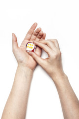 woman hand hold a dice isolated white.