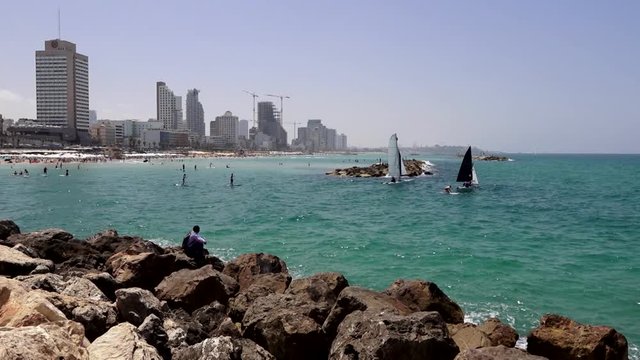 Sea. Breakwater. Yachts and wind. View of Tel and old Jaffa.