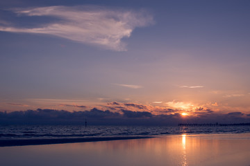 Fototapeta na wymiar Sunst at the beach with calm waters