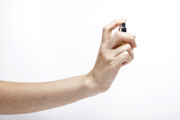 woman hand hold a perfume isolated white.