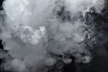 thick white smoke on black background filling almost the whole frame