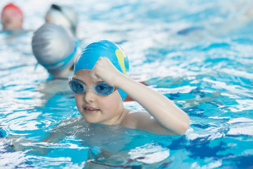 young and successful swimmers pose