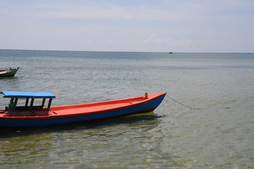 Naklejka na ściany i meble Red fishing boat