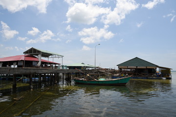 Fototapeta na wymiar Pier restaurants and boat in Phu Quock Vietnam