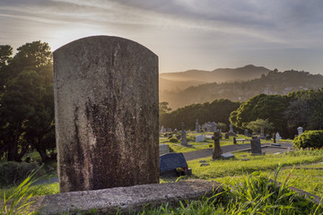 blank tomb stone at sunset