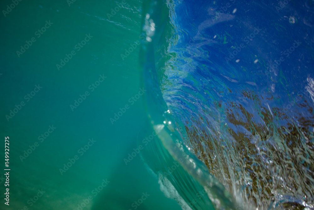 Wall mural ocean wave closing in barrel. view from inside with underwater part and a lip surface