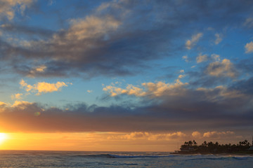 Naklejka na ściany i meble Beautiful ocean sunset with big waves in Hawaii