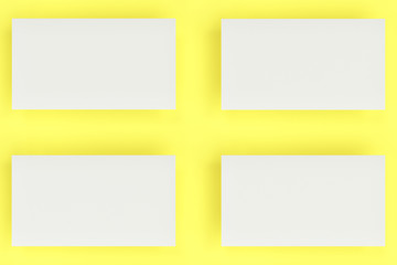 Obraz premium White blank business cards mock-up on yellow background