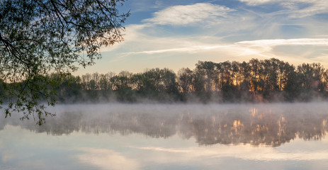 A view of the fog over the river in the early morning