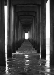 Peel and stick wall murals Narrow Alley Under pier endless perspective black and white