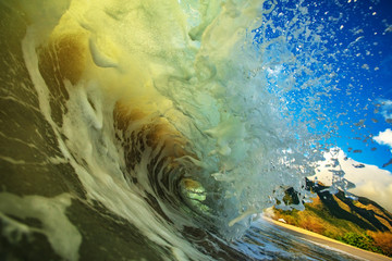 Ocean splashed wave in rip curl shape. Surfing sport activity in tropical water