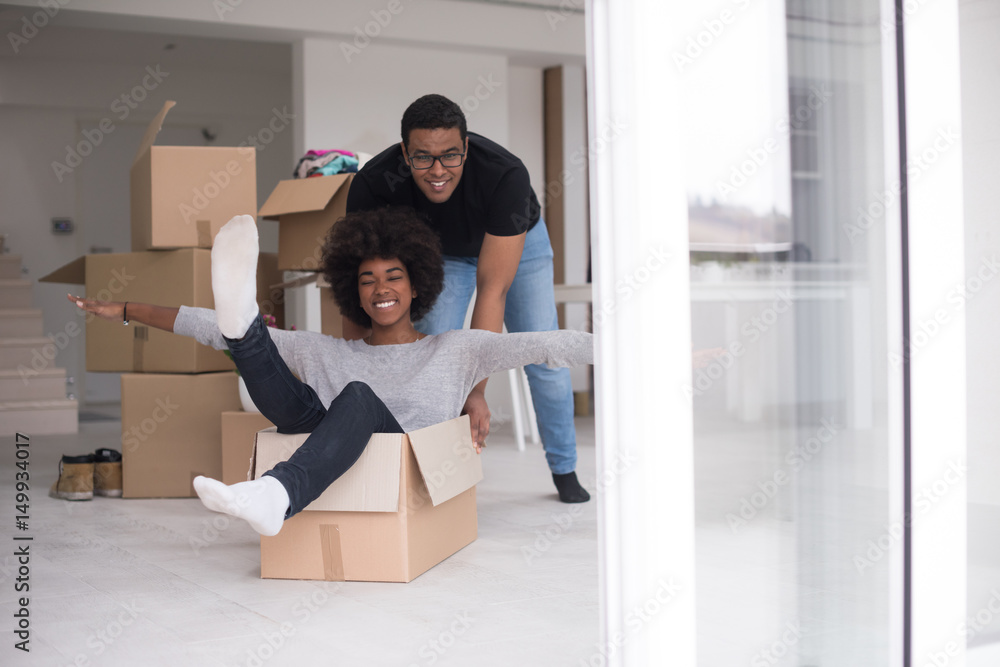 Wall mural African American couple  playing with packing material