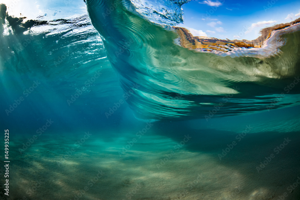 Wall mural ocean water in wave shape underwater view