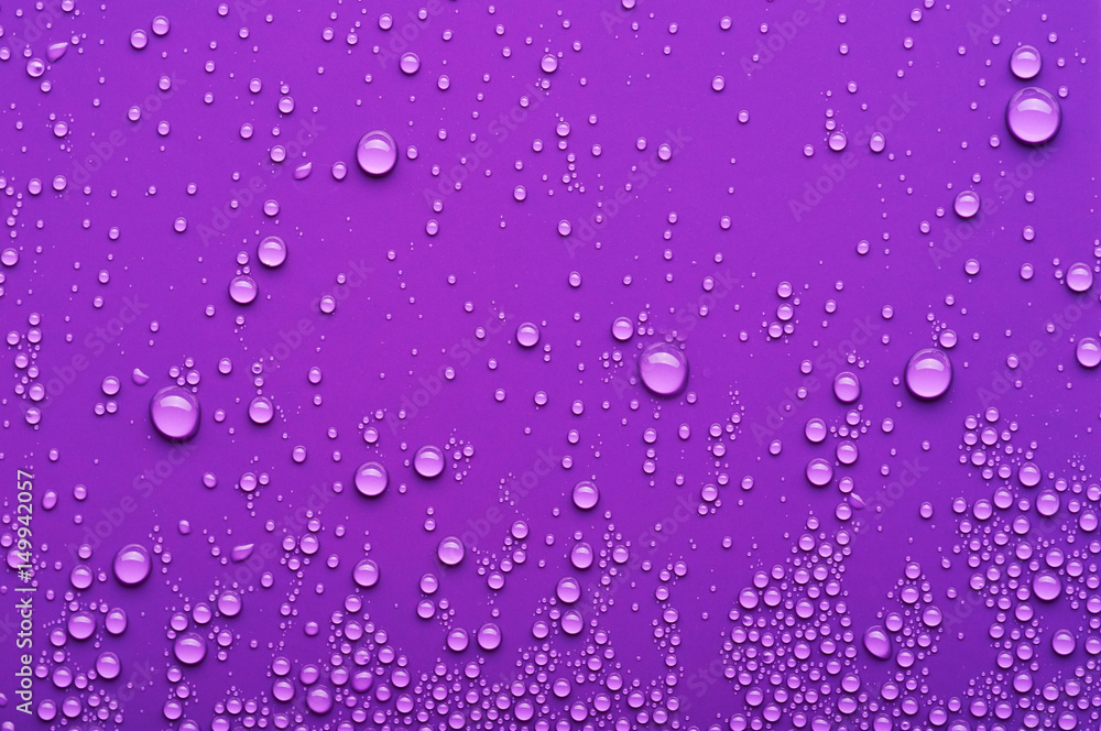 Wall mural water drops on a purple background