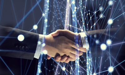 Business partners greeting each other. Mixed media