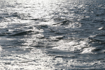 morning sunlight that hits the sea wave.