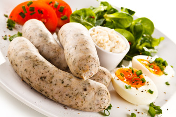White sausages with boiled eggs and horseradish