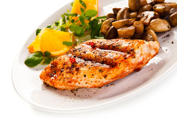 Grilled chicken fillet with mushrooms and oranges