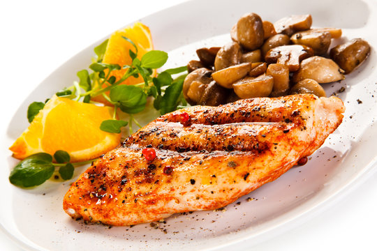 Grilled chicken fillet with mushrooms and oranges