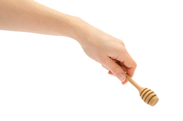woman hand holding honey spoon.