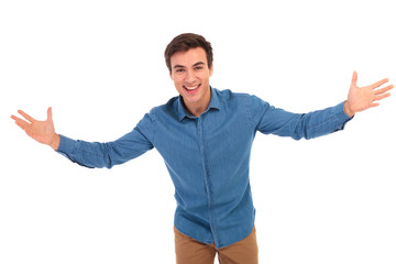 excited young casual man welcoming