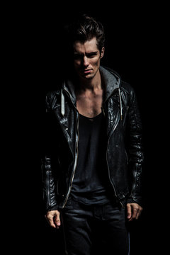 dramatic portrait of a young man in leather jacket