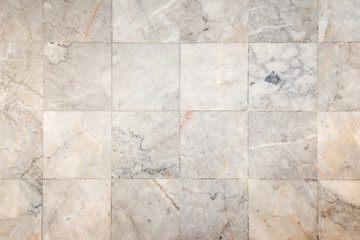 Close-up of a smooth marble floor with vignetting, viewed from above.