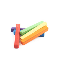 Pile of rainbow colored chalks isolated