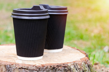 coffee Cup stands on stump. Concept bright start of day