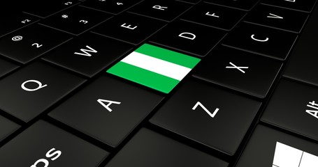 Close up of Nigeria flag button on laptop keyboard.