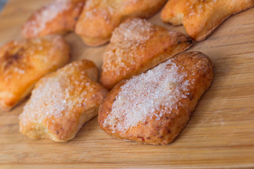 Cookies of different shapes with sugar for a Golden crust.