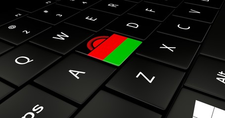 Close up of Malawi flag button on laptop keyboard.