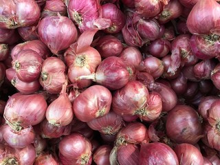 Red onions in plenty on display at local farmer's Thailand Market. Big Red Onions Background, Eleutherine bulbosa vegetable thai food.