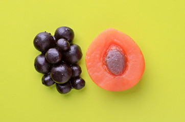Apricot and berries sweet marmalade candy on yellow background