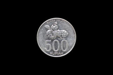 500 indonesian rupiah coin (2003) obverse isolated on black background.