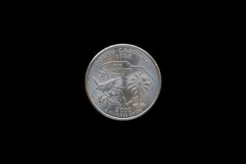 Twenty five American cents (Quarter Dollar) isolated on black background
