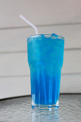 Ice Blue Hawaii in glass on table.