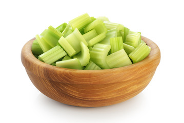 Fresh sliced celery in a wooden bowl isolated on white background.