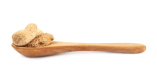 Spoon full of peanuts isolated