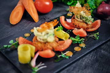 Seafood snacks with tomatoes.