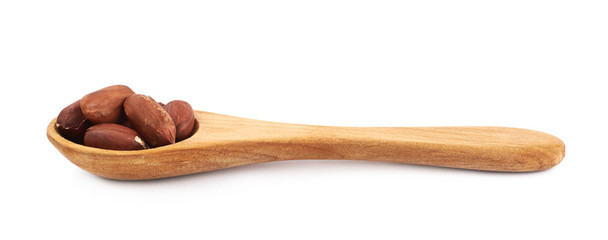 Spoon full of peanuts isolated