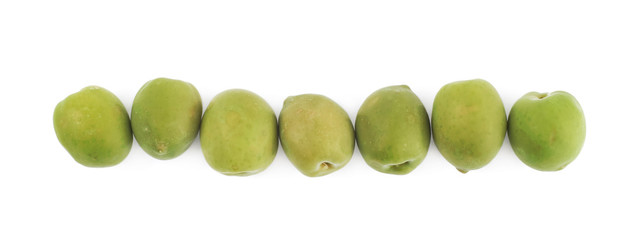 Multiple green olives lined up