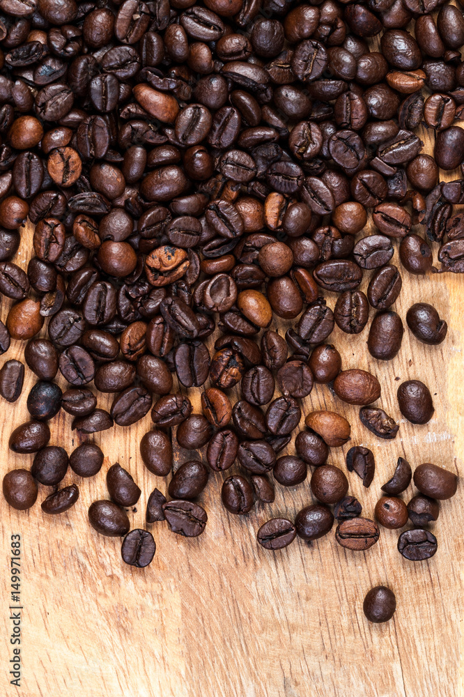 Poster macro roasted coffee beans textured wallpaper for your design with copy space.
