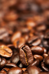 Macro Roasted coffee beans textured wallpaper for your design with copy space.