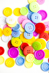 Fototapeta na wymiar Bright assorted buttons, mix colors