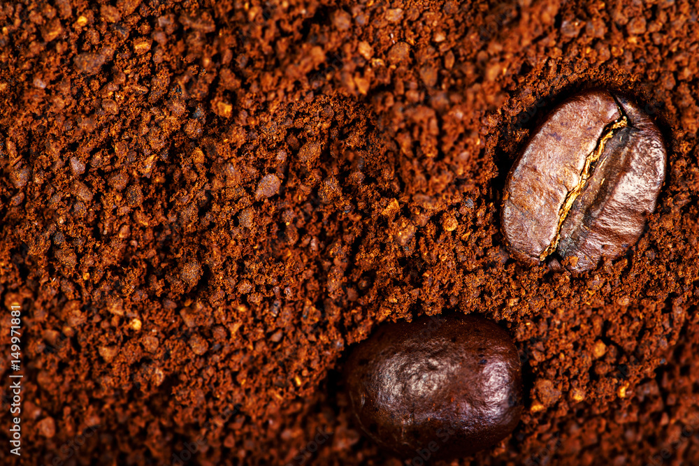 Poster macro roasted coffee beans textured wallpaper for your design with copy space.